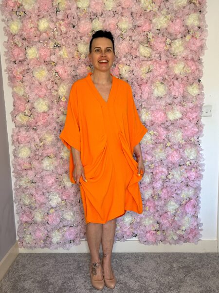 Loose Flowy Sadie dress in bright orange, gathered middle for comfort and style